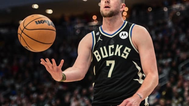 Milwaukee Bucks forward Joe Ingles (7) reacts in the third quarter during game against the Boston Celtics at Fiserv Forum.
